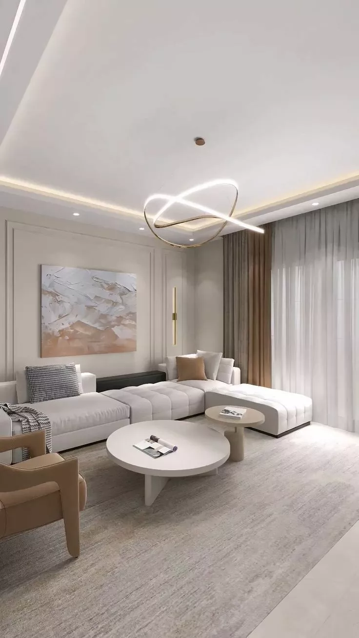 Discover the serene beauty of minimalist home design with this sophisticated living room featuring sleek lines, neutral tones, and modern lighting.