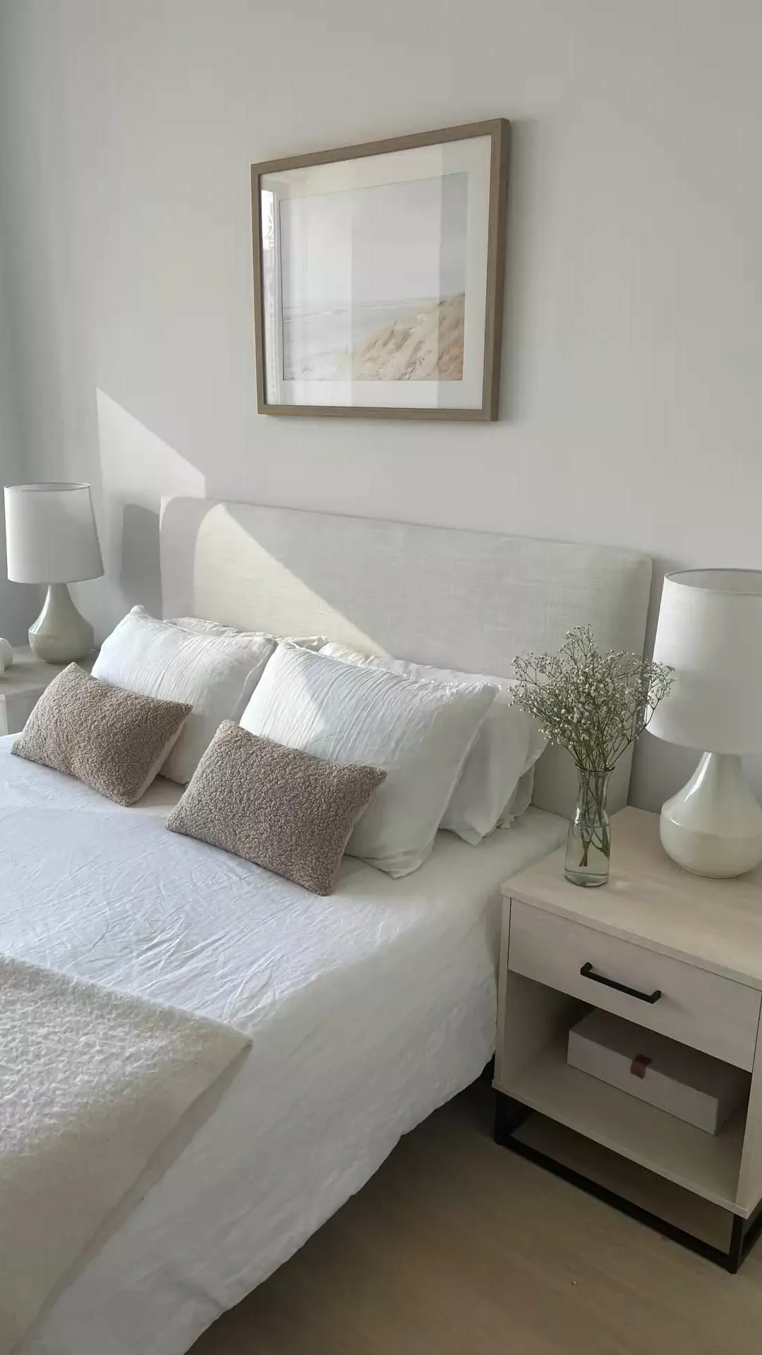 Immerse in a calming retreat with this minimalist bedroom adorned with soft neutral tones and understated decor that exudes tranquility and elegance.