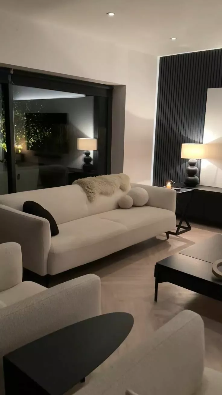 Discover the perfect blend of comfort and style in this modern living room. Chic furniture, warm lighting, and tasteful decor invite you to unwind.