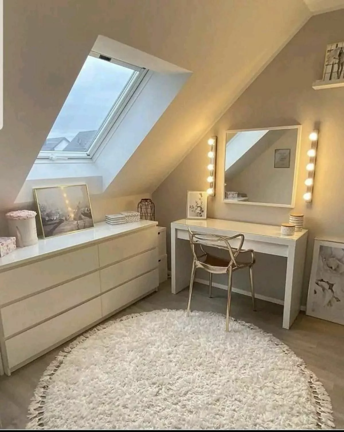 Discover the charm of this cozy attic vanity setup, featuring warm lighting, a chic chair, and elegant storage solutions.