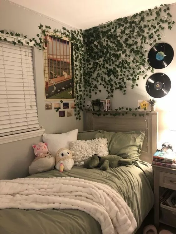 Discover a snug bedroom that blends natural aesthetics with nostalgic charm, featuring trailing ivy, record decor, and cute plushies.