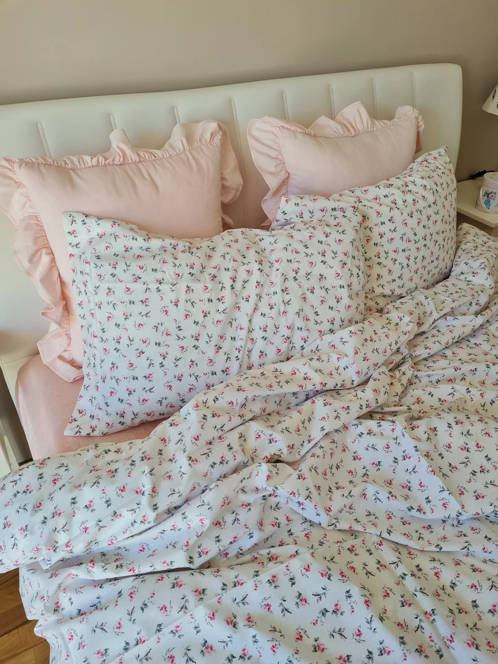 Experience the ultimate cozy retreat with our charming floral bliss bedding, featuring delicate pink ruffles and a delightful floral pattern.