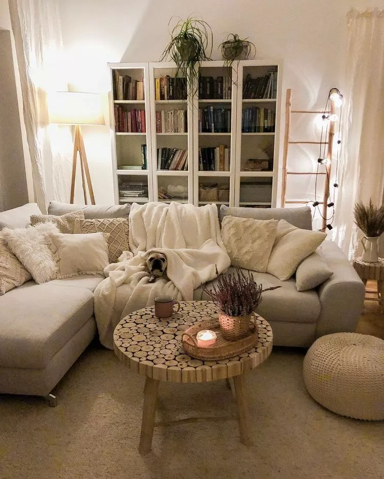 Unwind in a cozy bohemian style living room featuring soft furnishings, warm lighting, and a candlelit ambiance.