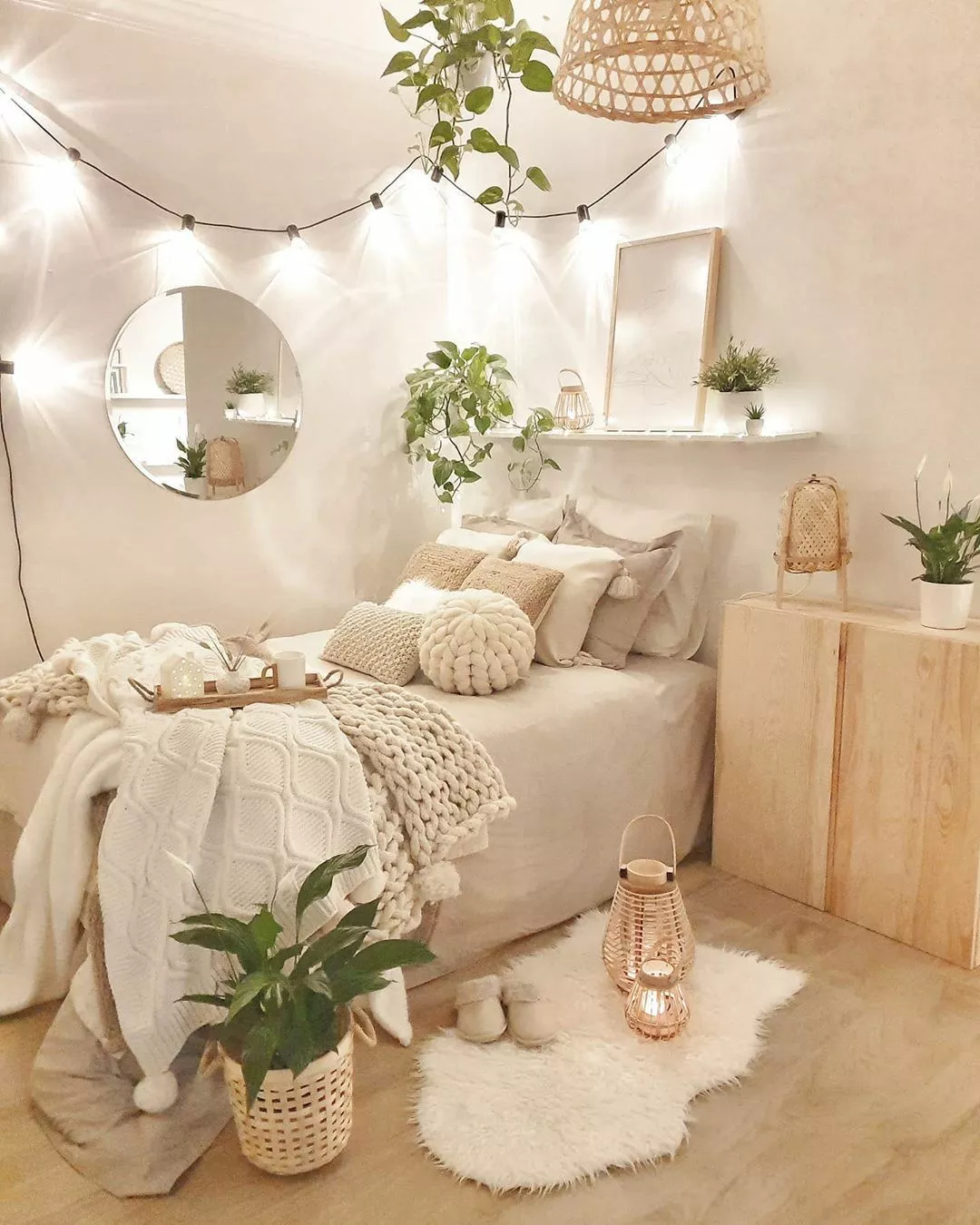 Discover the inviting charm of a boho chic bedroom, adorned with warm lighting, lush greenery, and textured decor elements.