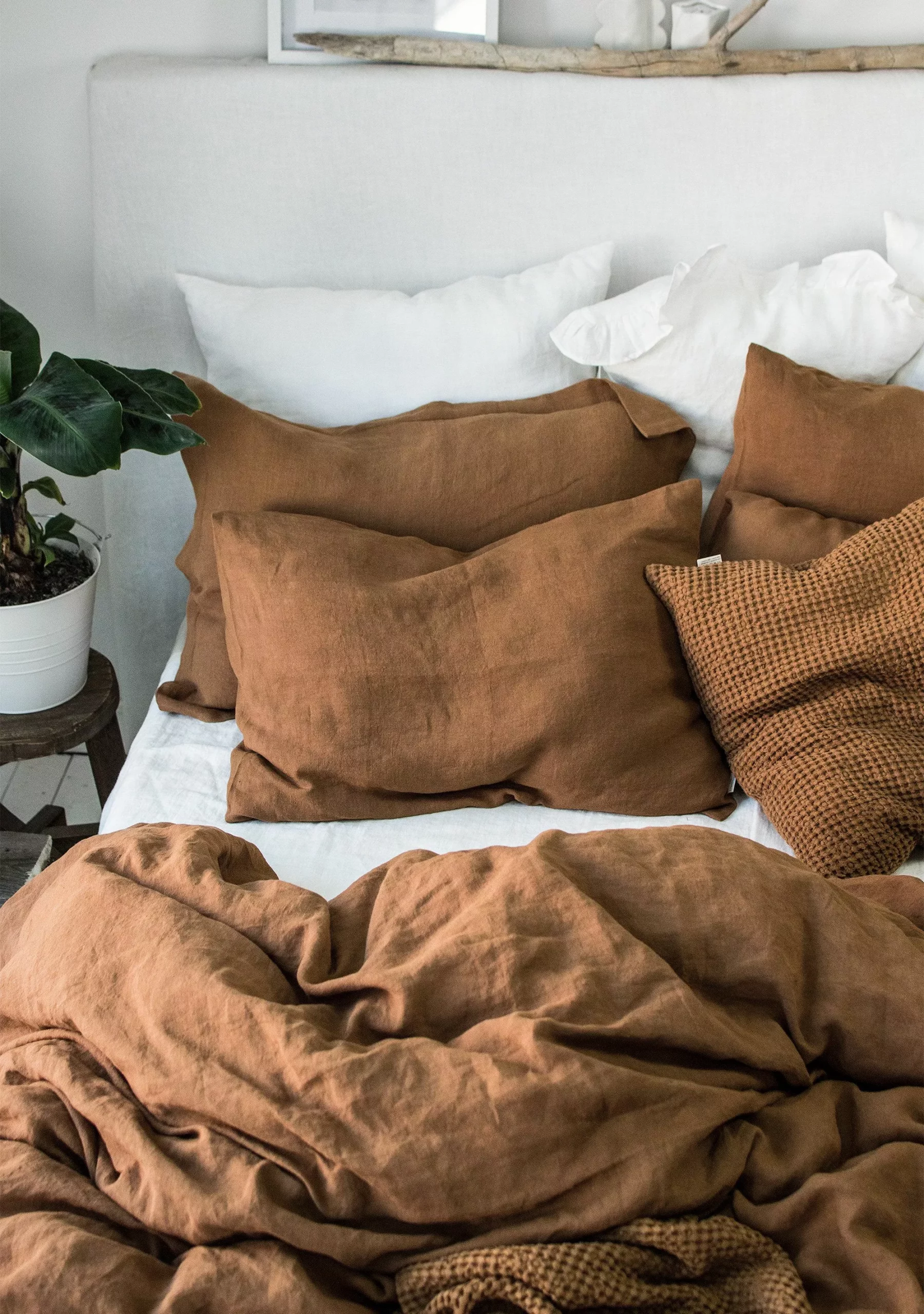 Transform your space with warm, earthy hues and plush textures for a serene oasis.