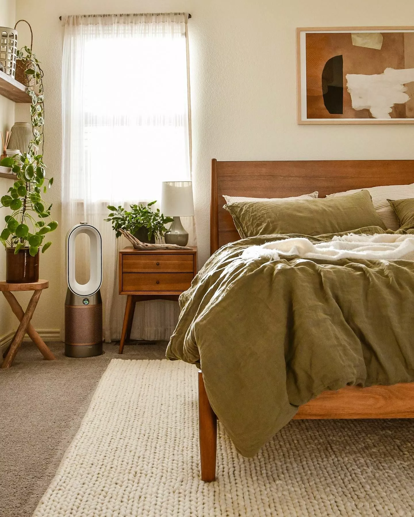 Unwind in a cozy earthy bedroom featuring natural wood elements, lush greenery, and soothing neutral tones.