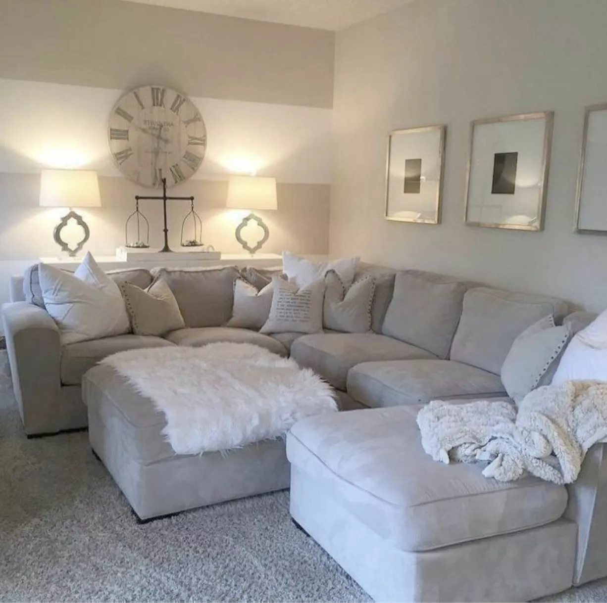 Embrace sophistication and comfort in your living space with this elegant setup featuring a plush sectional sofa, timeless decor, and a serene color palette.