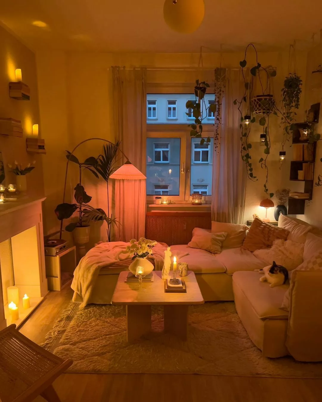 Immerse yourself in the warm, inviting ambiance of this bohemian-inspired living space, perfect for a relaxing evening.