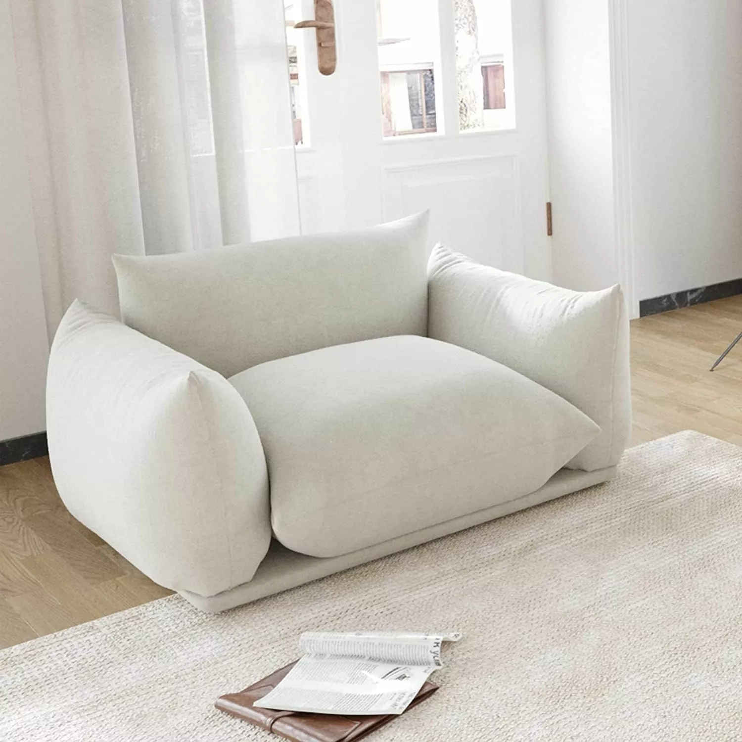 Plunge into the ultimate comfort experience with this minimalist armchair, a perfect blend of elegance and coziness for any modern living room.