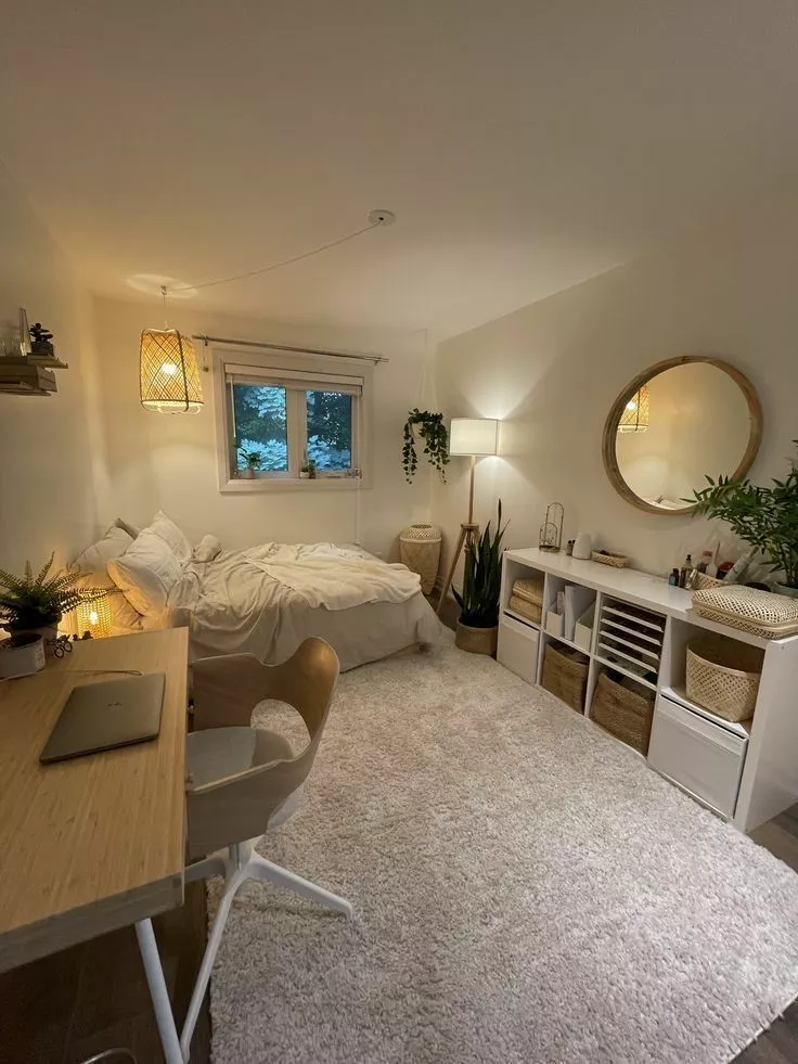 Explore a serene bedroom featuring natural tones, a plush rug, and woven accents. Perfect for a minimalist yet inviting retreat.