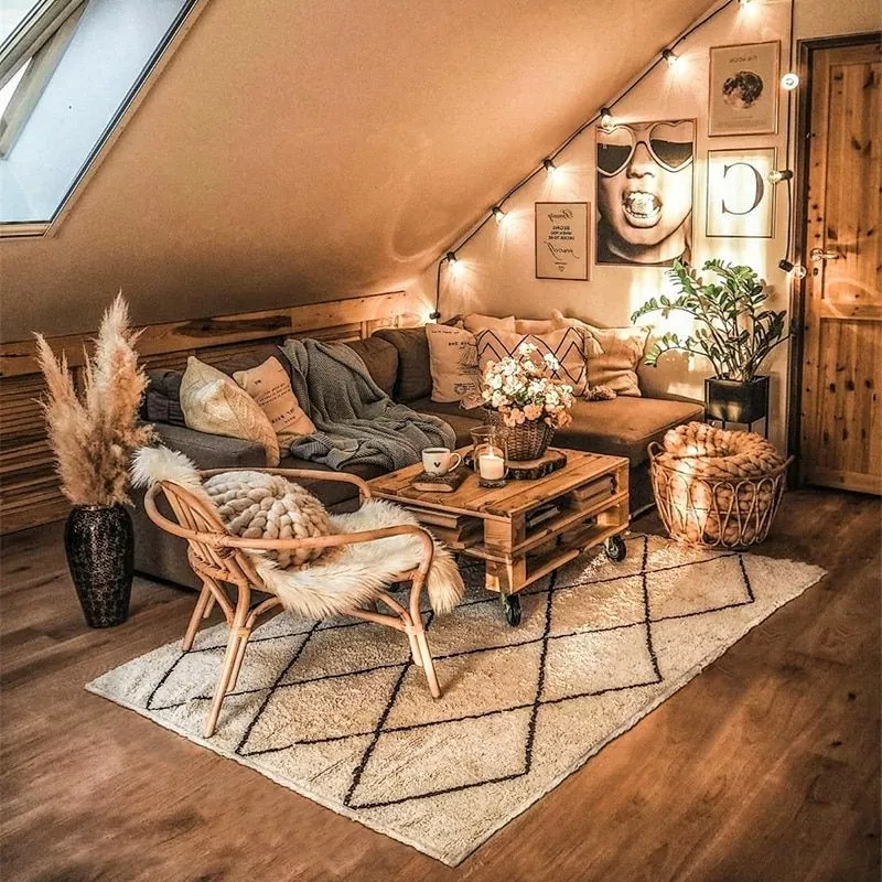 Discover the hidden charm of this rustic attic, featuring comfortable seating, soft lighting, and stylish decor that brings warmth to any home.