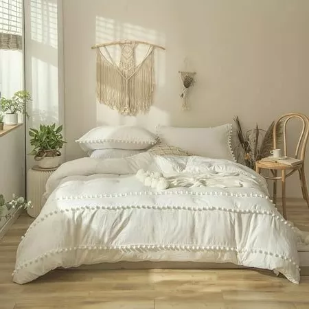 Create a dreamy bohemian bedroom with soft textures, natural elements, and serene tones for an ethereal and cozy retreat.