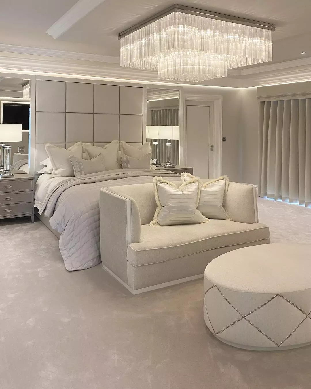 Discover the serene beauty of a neutral-toned bedroom featuring plush fabrics, elegant lighting, and sophisticated decor designed for ultimate comfort.