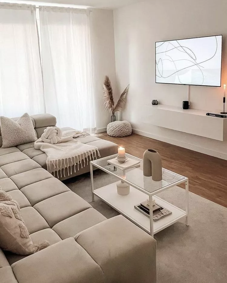 Discover this beautifully designed minimalist living room featuring cozy neutrals, modern decor, and elegant touches.