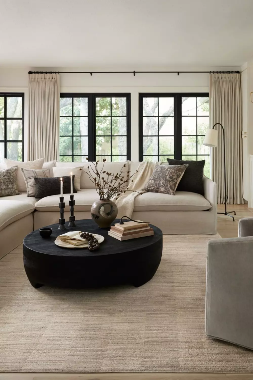 Elevate your home with this modern living room featuring neutral tones, sleek furniture, and ambient lighting for a cozy and inviting atmosphere.