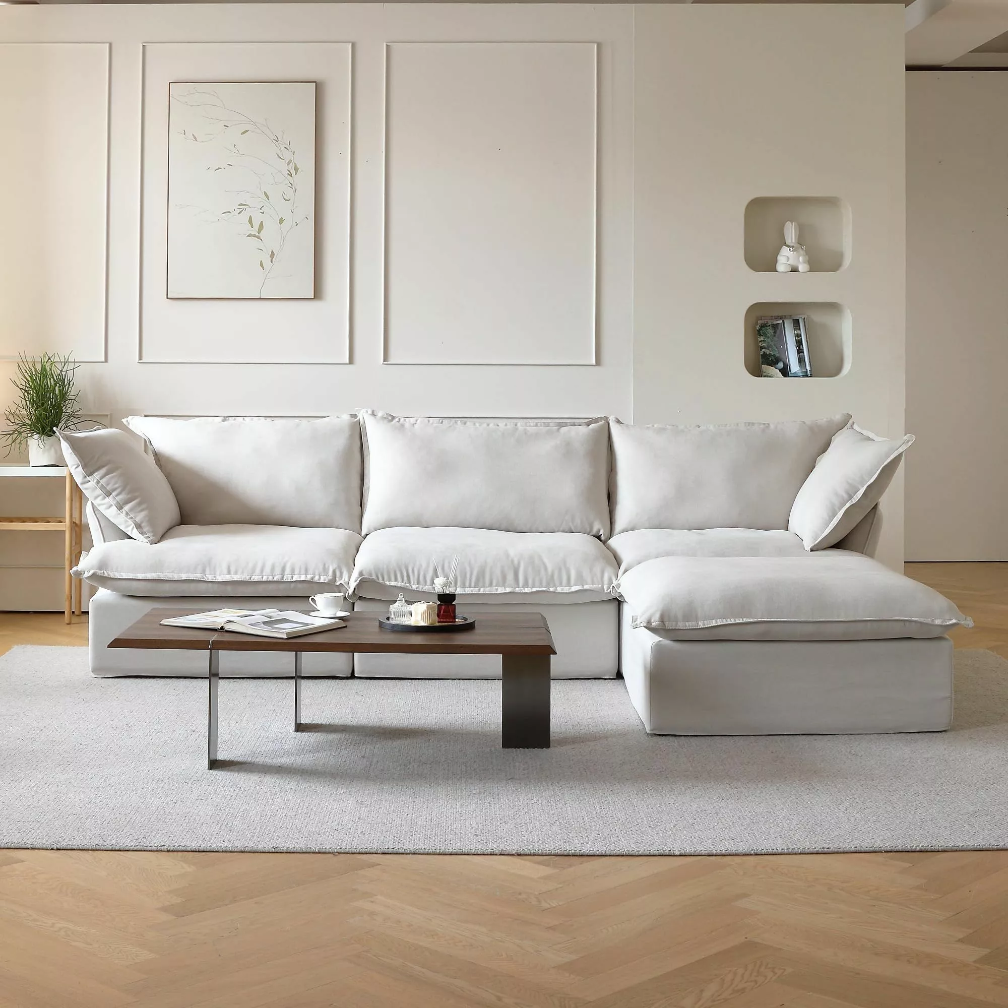 Discover the minimalist elegance of this chic, modern living room setup, featuring a pristine white sectional sofa and streamlined wooden coffee table.