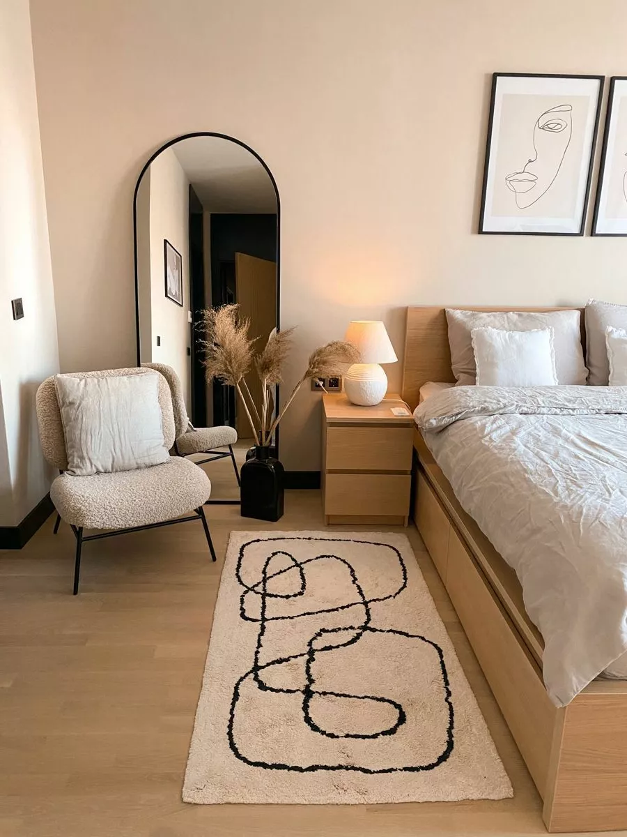 Discover the perfect blend of modern elegance and cozy charm. Featuring abstract art, neutral tones, and stylish decor items for a serene bedroom retreat.