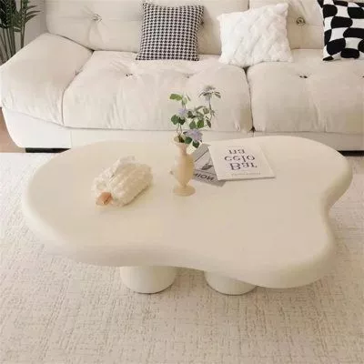 Upgrade your home décor with this chic, artistically designed white coffee table, perfect for contemporary living spaces.