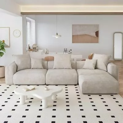 Experience modern minimalism in a living room with sleek furnishings, soft neutral tones, and an airy layout.