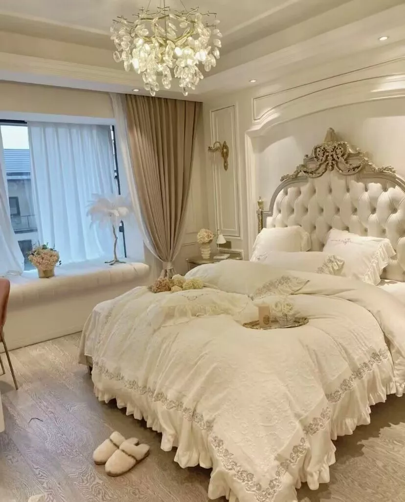 Experience opulence in a luxury bedroom design featuring elegant details, plush bedding, and a sophisticated chandelier.