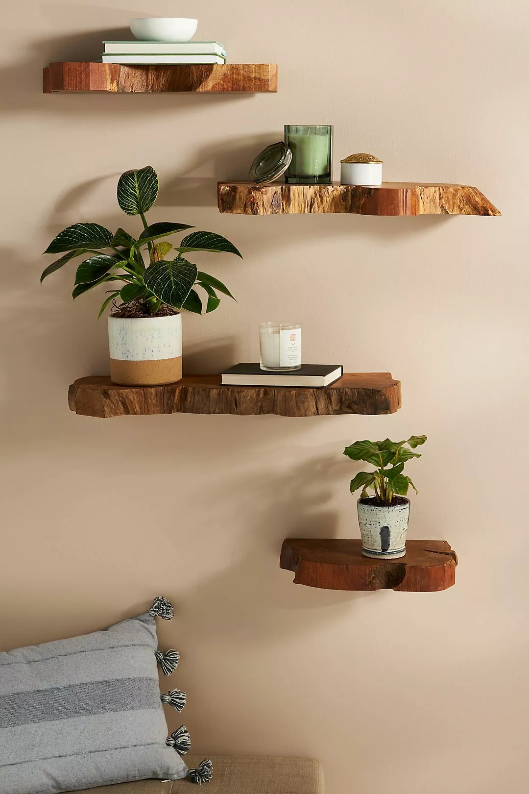 Explore the charm of these handcrafted wooden floating shelves, perfect for adding a touch of natural elegance to any living space.