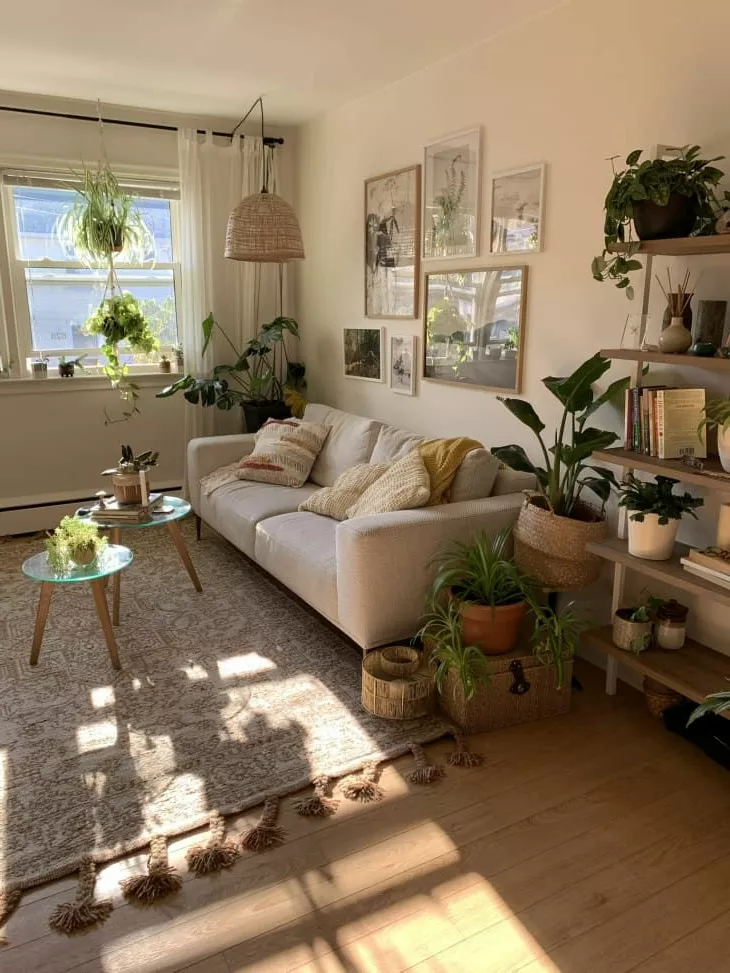 Dive into a serene, boho-inspired living room with lush greenery, soft lighting, and natural textures, creating an inviting and tranquil space.