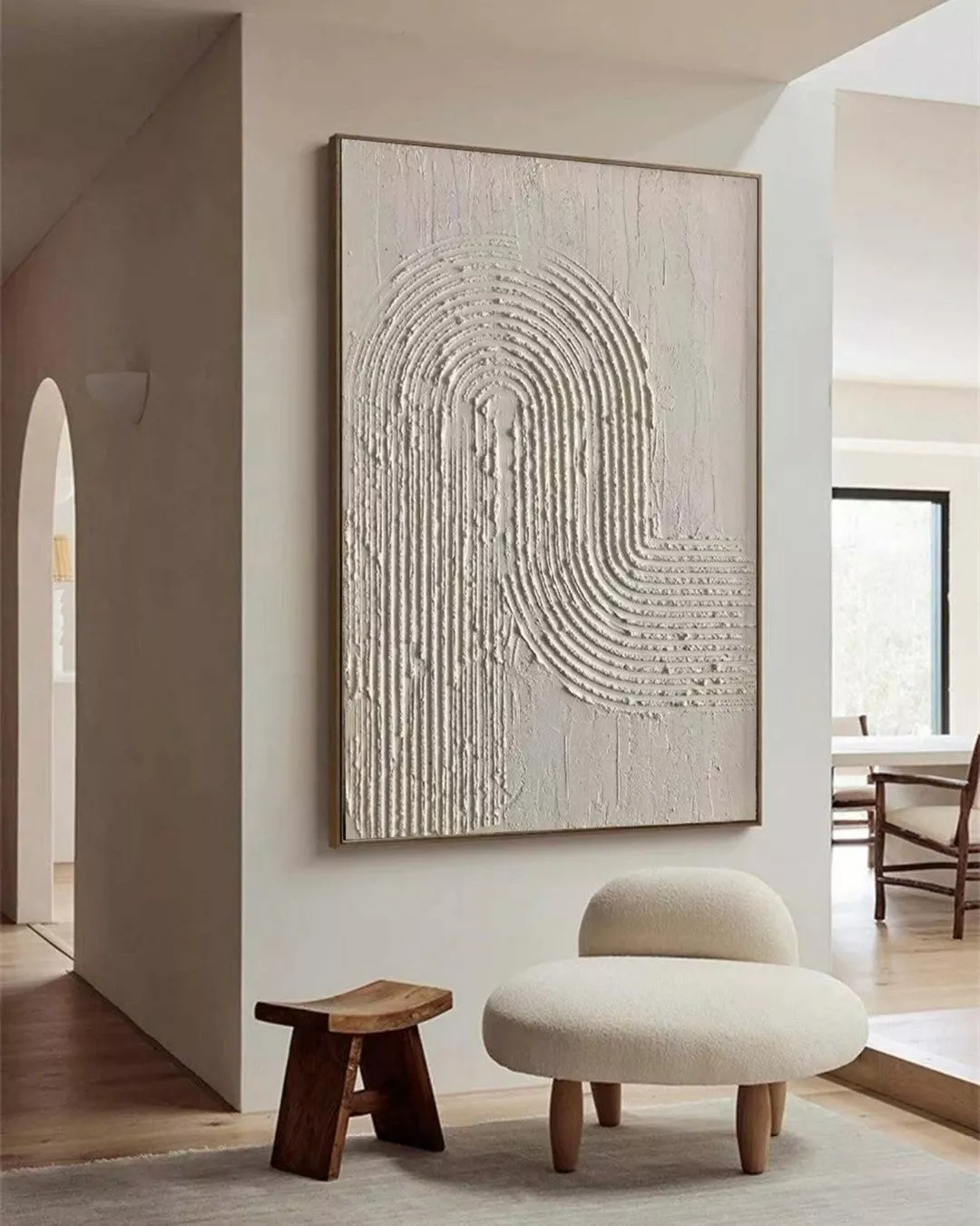 Discover how this textured wall art piece becomes the centerpiece of minimalist elegance, perfectly paired with cozy furniture.