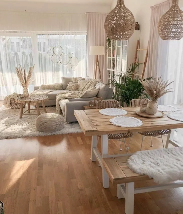 Transform your home with sunlit serenity, featuring a bohemian style living room and dining area with natural textures, airy decor, and cozy elegance.