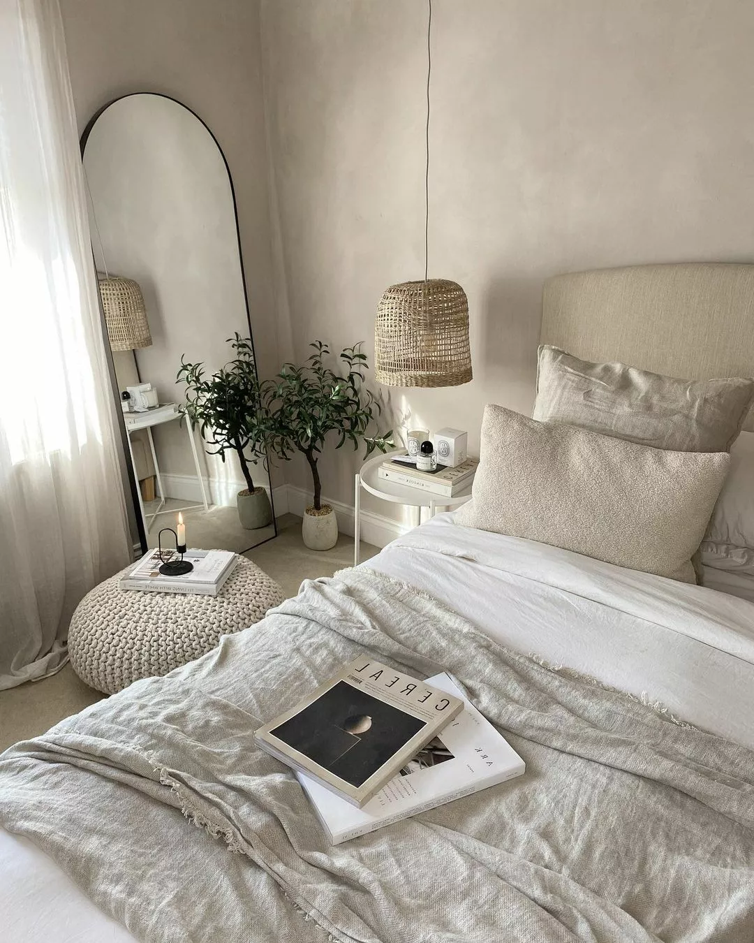 Discover the serene elegance of minimalist design, featuring cozy textures, neutral tones, and chic decor elements that create a calming sanctuary.