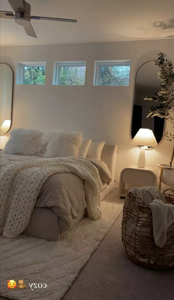 Transform your bedroom into a tranquil retreat with soft textures, warm lighting, and neutral tones for the ultimate cozy vibe.